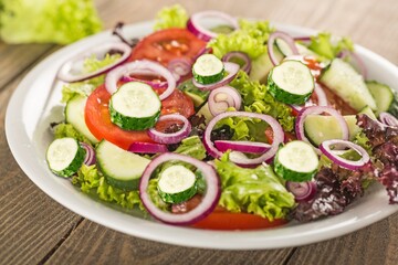 Green fresh ripe cucumbers vegetable slices in salad