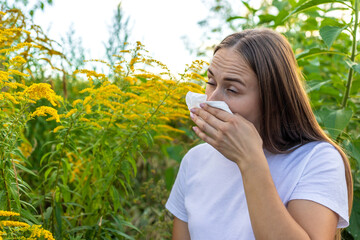 Fototapeta premium A woman is allergic to ragweed. Nature.