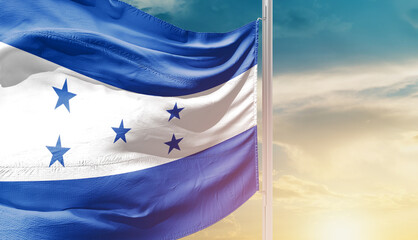 Honduras national flag waving in an amazing sunlight. National flag wavering on mast.