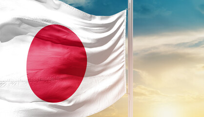 Japan national flag waving in an amazing sunlight. National flag wavering on mast.