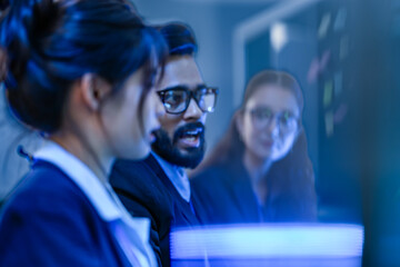 An agile development team participates in a sprint retrospective meeting. A female developer...