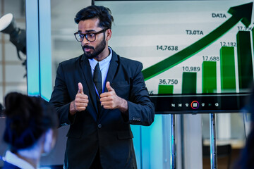 A senior software architect leads a code review session, explaining a complex algorithm to junior...