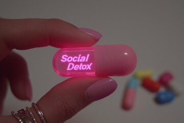 Pink Glowing Capsule with a "Social Detox" Label