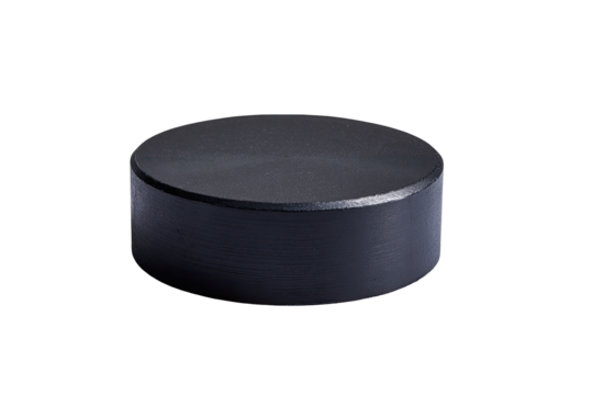 Black puck isolated studio shot, dark background, sports equipment