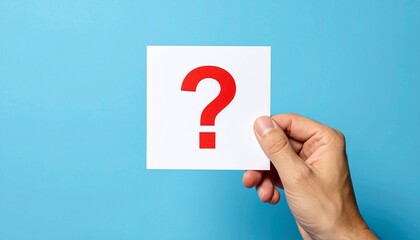 Hand Holding Question Mark on Blue Background