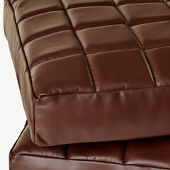 Brown leather upholstery creates a luxurious and comfortable seating experience