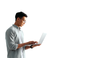 Standing Southeast Asian Man Typing on Laptop with Focused Expression, Side-Angled Office Style, Isolated on Transparent Background (2)
