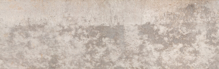 A raw, untreated exposed concrete surface with a slightly irregular texture.