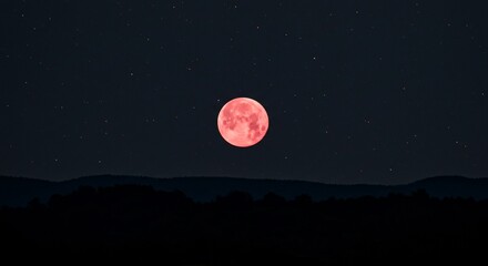 Ethereal pink moon glows above dark silhouetted hills under a starry night sky