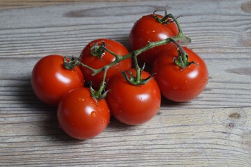 a bunch of fresh tomatoes with water droplets, macro