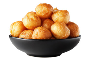 Golden fried dough balls piled high in a black ceramic bowl isolated on a transparent background food