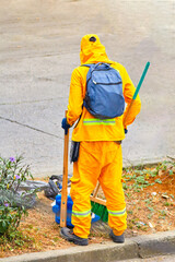 Street cleaning by a sanitation worker.