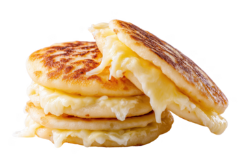 Stack of golden brown arepas stuffed with melted white cheese isolated on a transparent background food