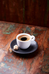 Cup of coffee on rustic wooden background. Soft focus. Copy space	
