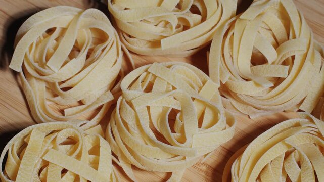 Italian tagliatelle pasta packaging window, Fettuccine pasta, close up, not cooked