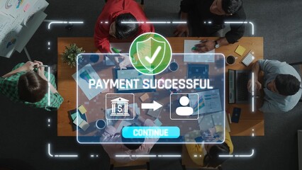 A dynamic top view of a diverse team collaborating in a modern workspace, highlighting a successful payment notification on a digital interface. Raster