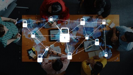 A diverse team engages in a collaborative cybersecurity meeting. A digital lock icon and network...