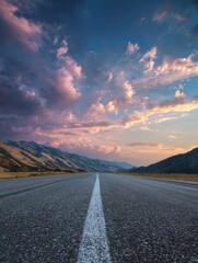 Asphalt road stretching into a vibrant sunset (1)