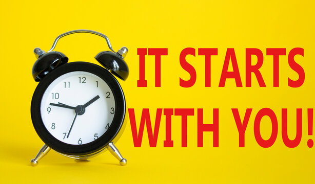 It starts with you symbol. Beautiful yellow background with alarm clock. Business and It starts with you concept. Copy space.