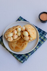 Traditional South American arepa with quail egg, styled as a hearty breakfast option for Latin cuisine food stock