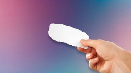 Human hand holds paper note or card