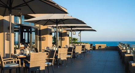 Fototapeta premium An Elegant Outdoor Dining Experience With Ocean View On A Beautiful Sunny Day