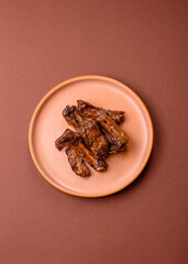 Grilled beef or pork ribs, meat cooked on a barbecue with salt and pepper. Grilled ribs