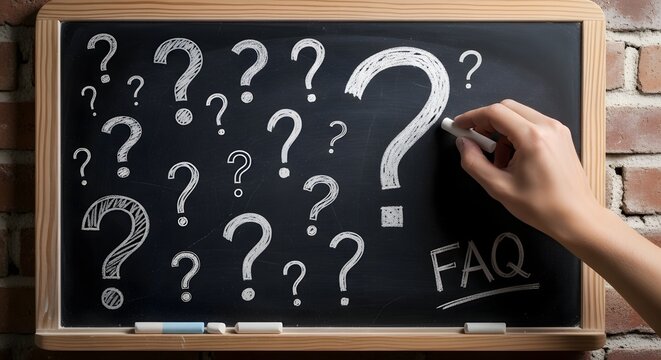 faq and question marks on a blackboard with chalk
