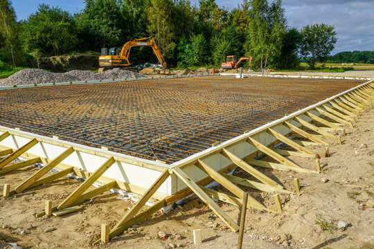 Reinforced steel rebar foundation with wooden formwork prepared for concrete slab construction