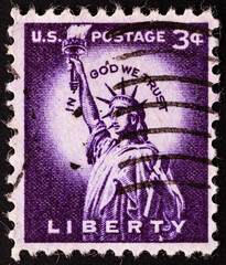 UNITED STATES OF AMERICA - CIRCA 1954.postage stamp printed in USA shows a picture of Statue of Liberty in a close-up containing the motto: "in god we trust", circa 1954