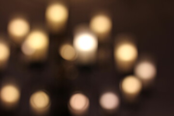 Fototapeta premium A dreamy view of a lamp glowing in the dark room.