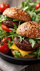 Two succulent beef cheeseburgers with melted cheese and fresh lettuce sit invitingly in a cast-iron pan, ready to enjoy
