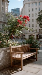 Sunlight casts shadows on a wooden bench resting beneath a blooming rose tree, adjacent to a bright white wall on a calm street