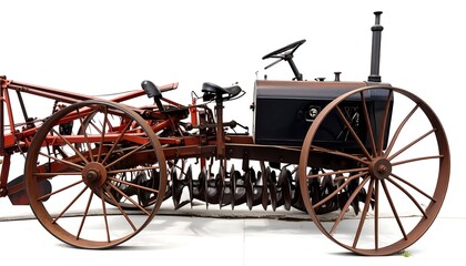 Fototapeta premium Vintage farm tractor with plow