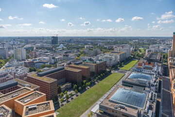 Obraz premium Berlin with Tempodrom. View over Berlin with the striking Tempodrom in the background. Modern office buildings and residential buildings characterize the cityscape.