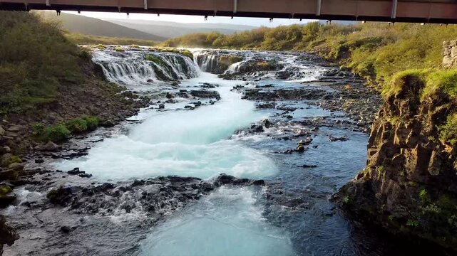 Aerial Drone View Flying Under Foot Bridge Toward Br&uacute;arfoss  Waterfall