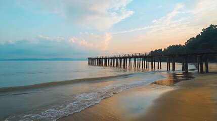 Fototapeta premium Serene Beach Pier Landscape Under Pastel Skies with Calm Water and Sandy Shoreline
