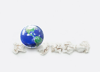 Earth with crumpled white paper balls on white background, Too many waste for our world concept, save earth concept, Elements of this image furnished by NASA