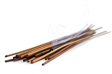 Burning incense sticks with smoke on white. Aroma sticks on white background