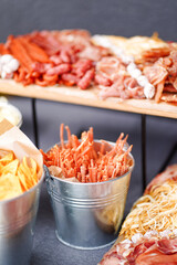 Closeup of wedding snacks and appetizers prepared for guests.