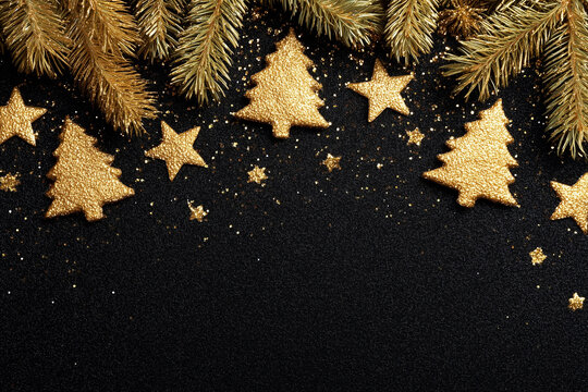 A black background with gold stars and trees