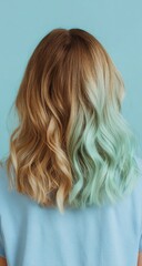 Naklejka premium Woman's back view, light-brown/mint-green ombre hair
