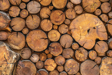 Sacked logs of firewood texture. Firewood background.
