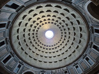 Rome, Italy - 10 January 2025. The Pantheon's massive coffered dome viewed from below, featuring a central oculus that opens to the sky.