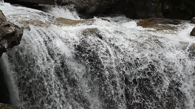 Beautiful nature footage of a mountain stream near Cascade du Cerisey in France