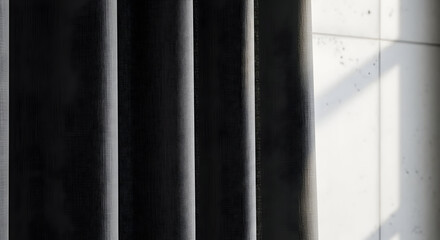 Dark Vertical Curtains In Front Of A Window Create Interesting Shadows And Patterns