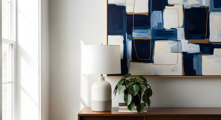 Decor At Home: A Minimalist Room With A Lamp, Painting And A Houseplant