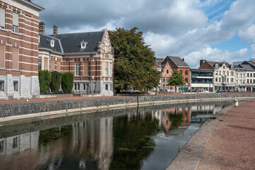 Houses and historical buildings reflecting in the water of the old river Durme in Dendermonde, East Flemish Region, Belgium
