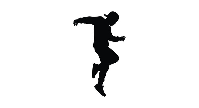 a silhouette of a person in mid jump wearing a hat