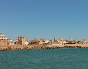 Obraz premium Cathedral of Cadiz with golden dome seen from the seafront in Andalusia, Spain, September 2025.